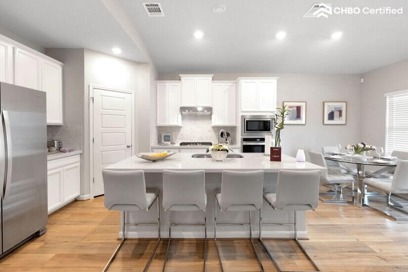 Fully equipped modern kitchen with breakfast bar seating.
