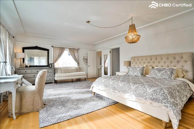 view of desk and bed in king bedroom