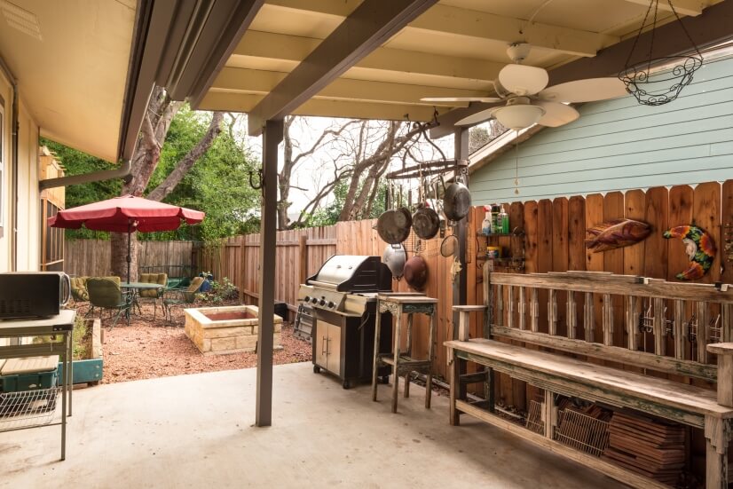Covered Patio on side with BBQ and fire pit