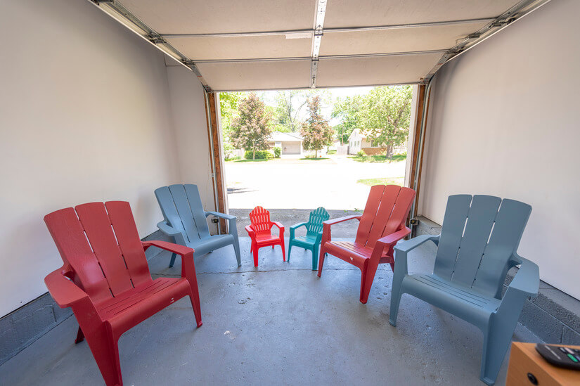 Game room features an assortment of Adirondack chairs.