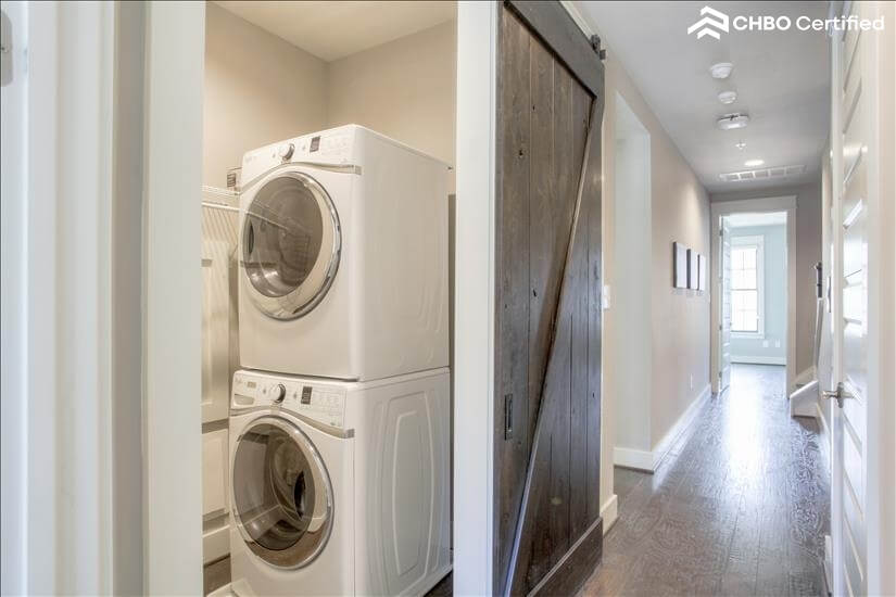 Maytag washer/dryer adjacent to bedrooms