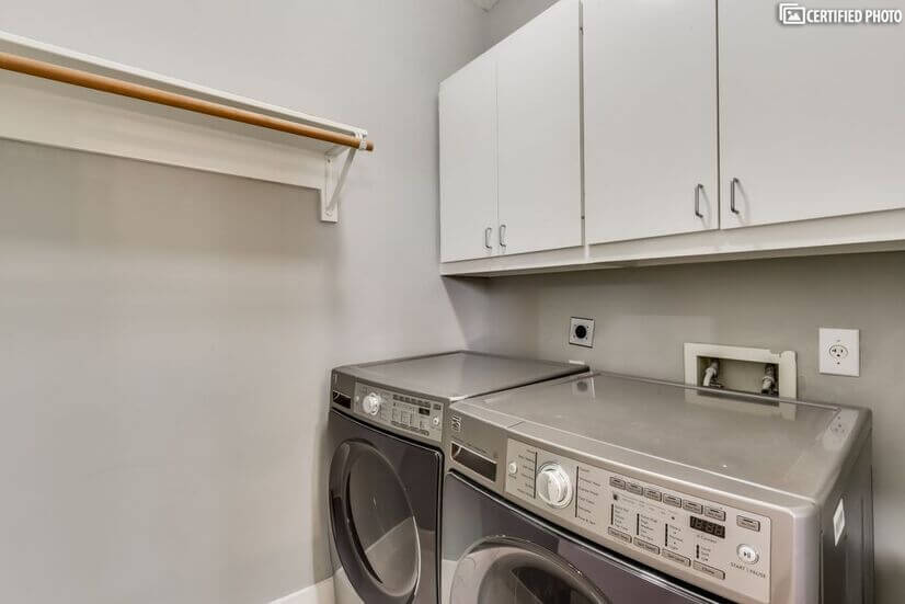Washer/Dryer room with new Samsung appliances