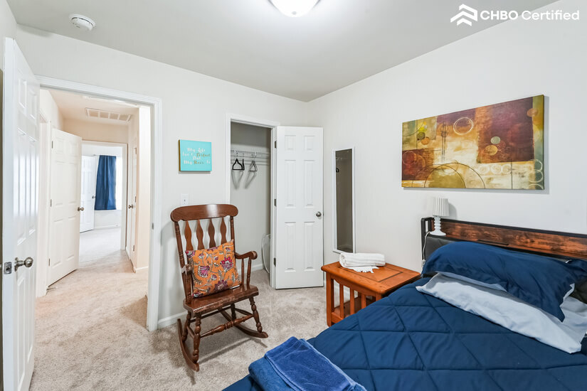 Bedroom is across from the bathroom.