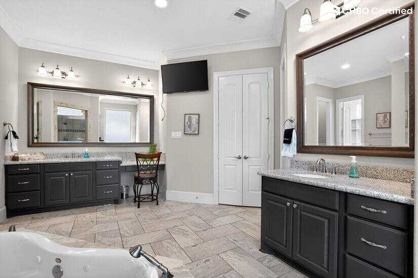 Double vanity bathroom with mirrors