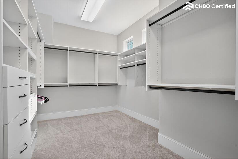 Walk in closet with built-in shelving