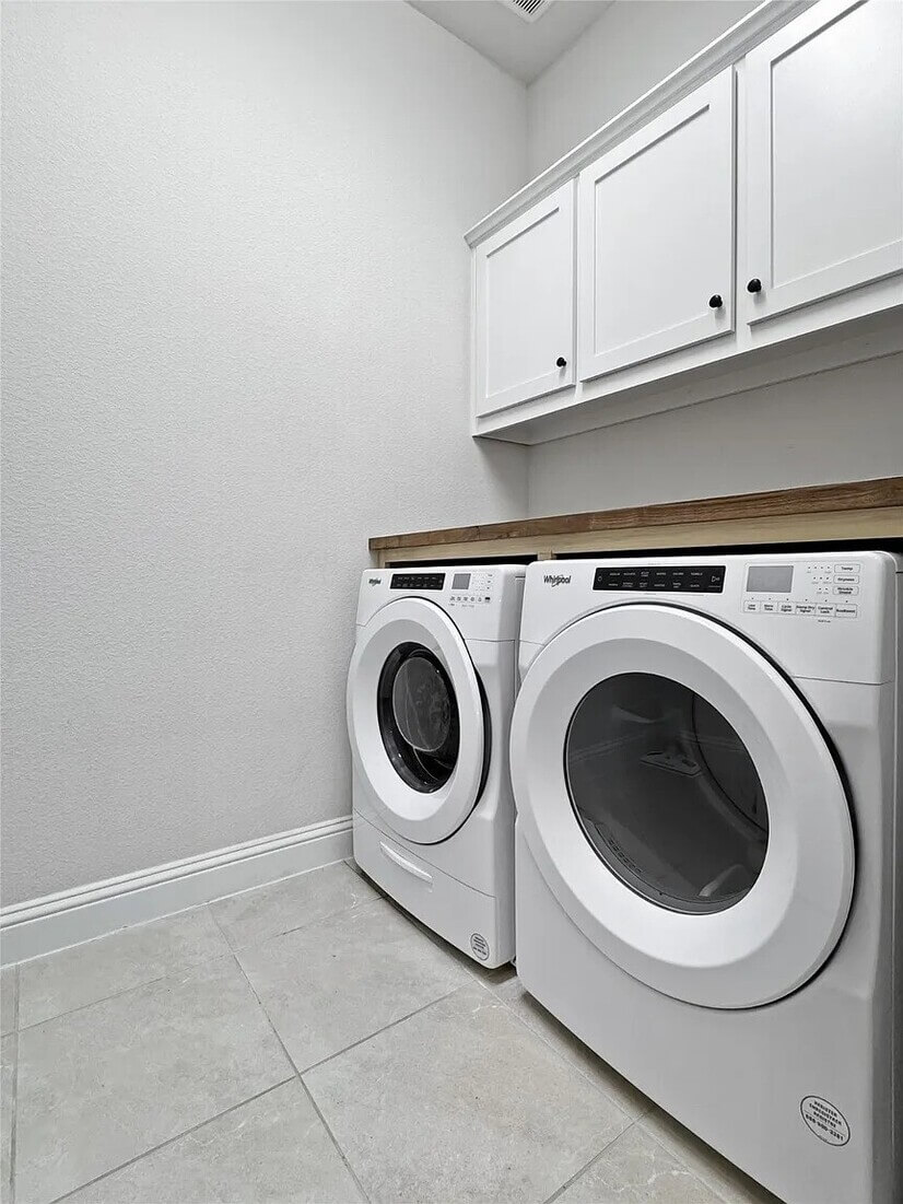 Laundry room with built-in shelf
