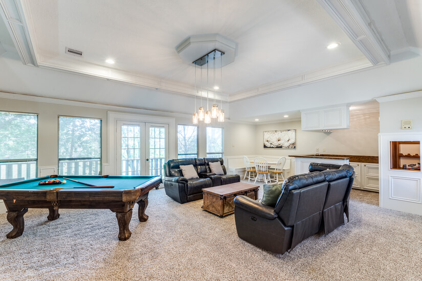 Game room with TV projector and pool table.