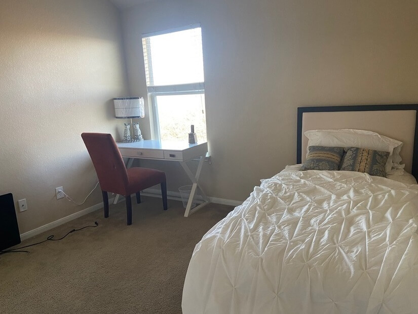 Room 138 x 140 inch. Single bed w/ view of woods/back of hou