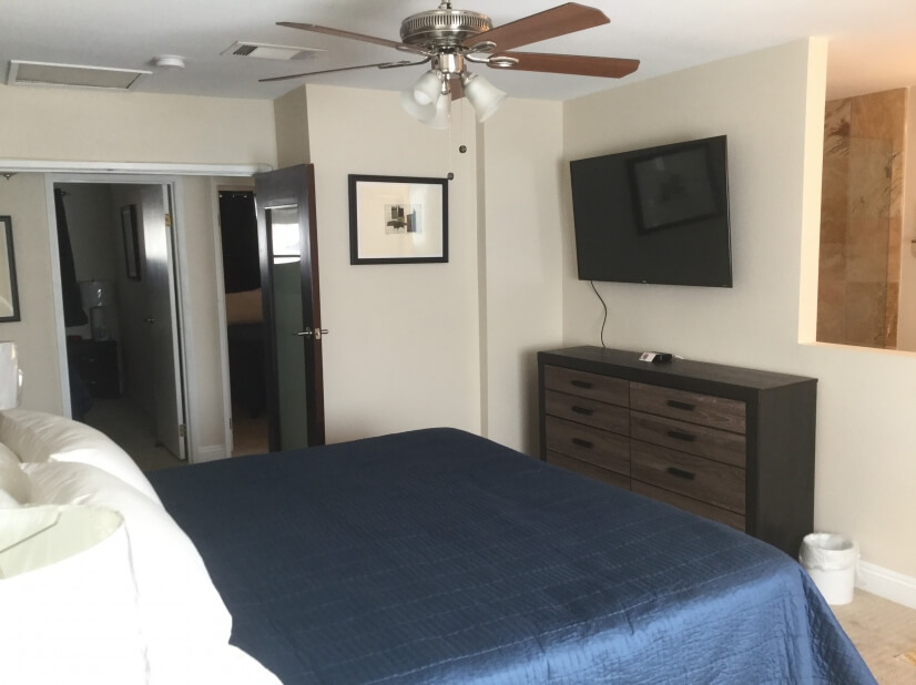 Master suite offers flat screen TV & master b