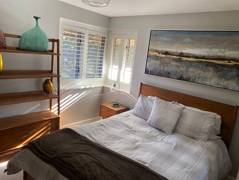 Bedroom 1 w Queen bed,dresser and shelving