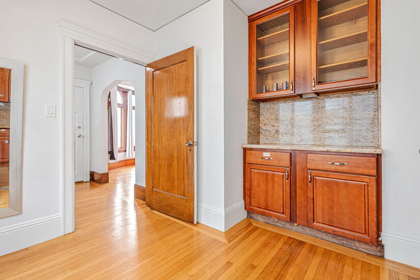 Open room next to foyer and entry to kitchen