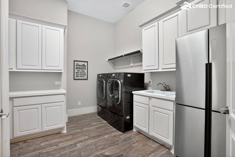 Laundry room with full appliances