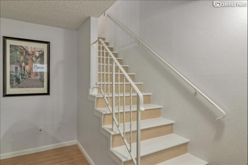 Stairway to bedrooms and full bath