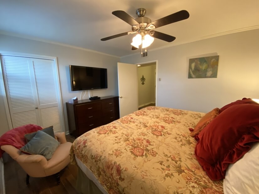 Bedroom 2 with a 50” TV and DVD player