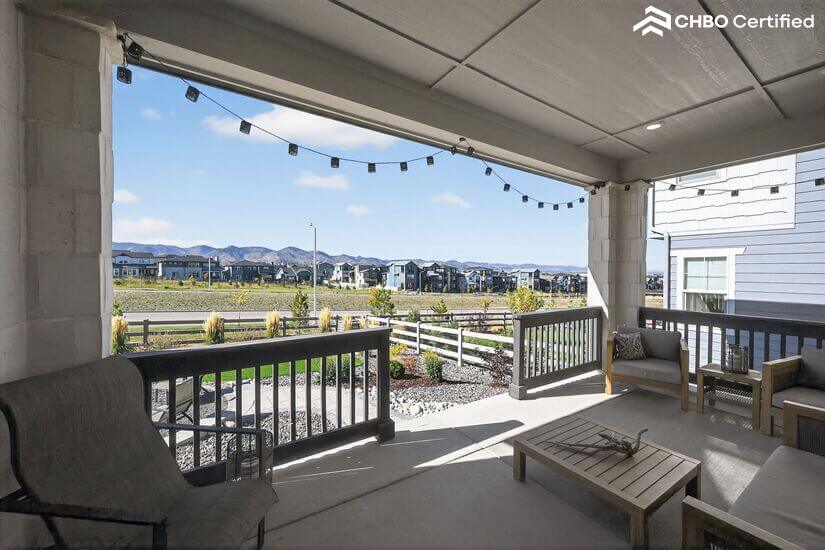 Furnished back porch w/ decorative lighting & mountain views