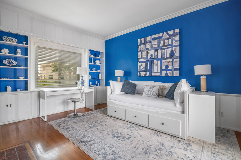 Blue room with Daybed, work station, closet
