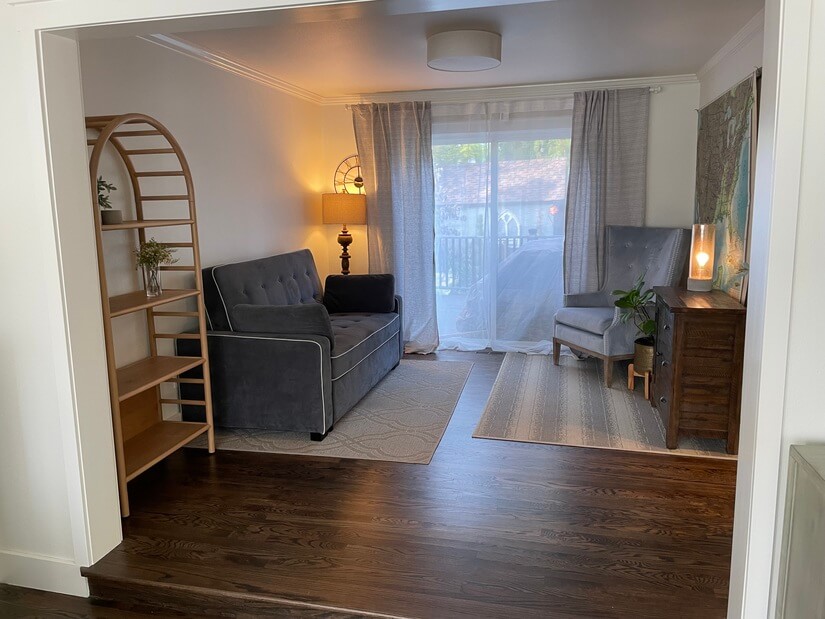 Sitting area with hideaway bed. Sliding door open to a deck.