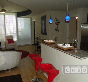 Adjustable bold red barstools allows for hang