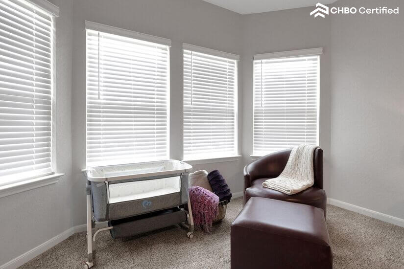 Crib and nursing chair for baby-friendly comfort.