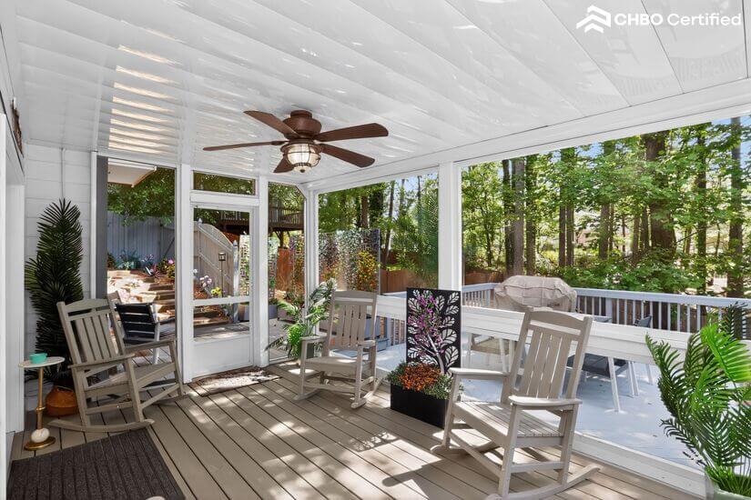 Screened porch gives relaxation & privacy on rocking chairs.