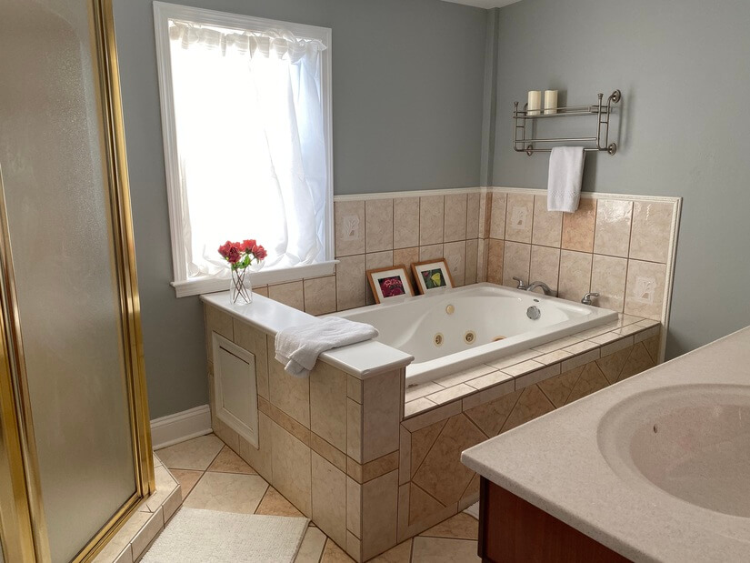 Master bath with double vanity and jetted tub