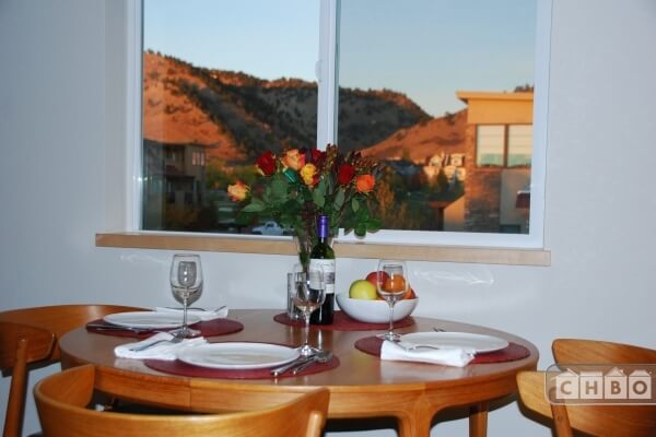 Dining room table and view west. Expands to f