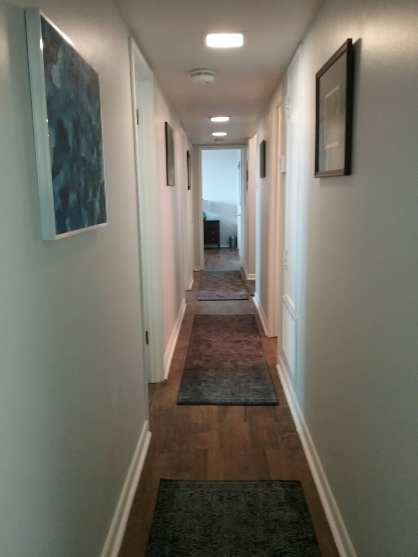 Main hallway with ceramic wood floors through