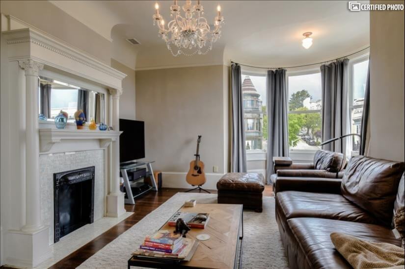 Cozy formal/informal living room with 65" smart TV.