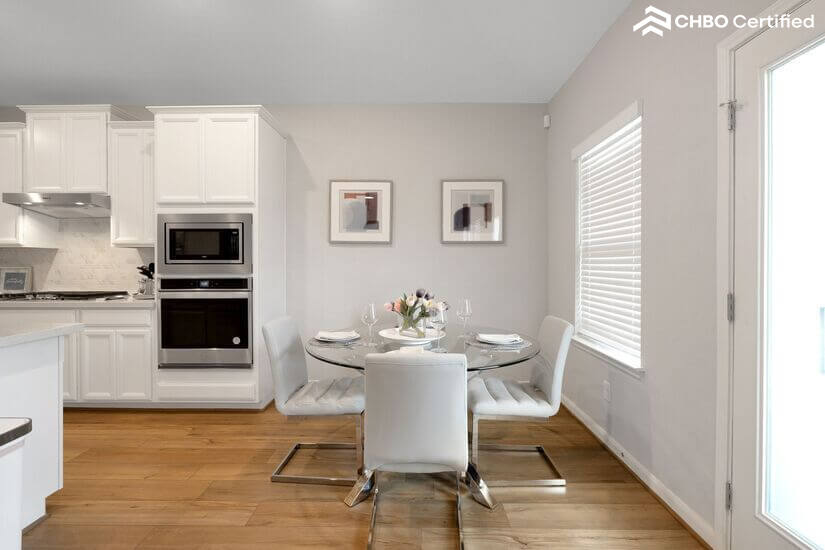 Cozy breakfast nook with natural light and modern seating.