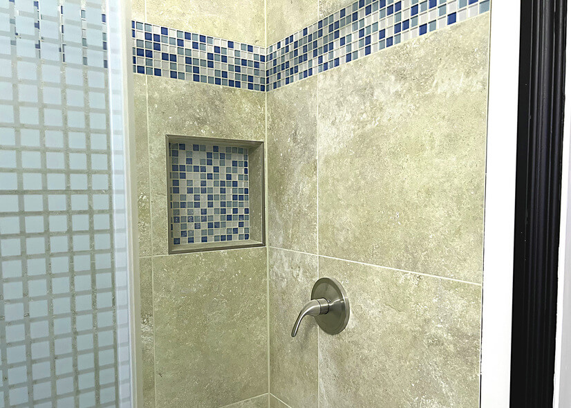 travertine Style shower with glass inlaid