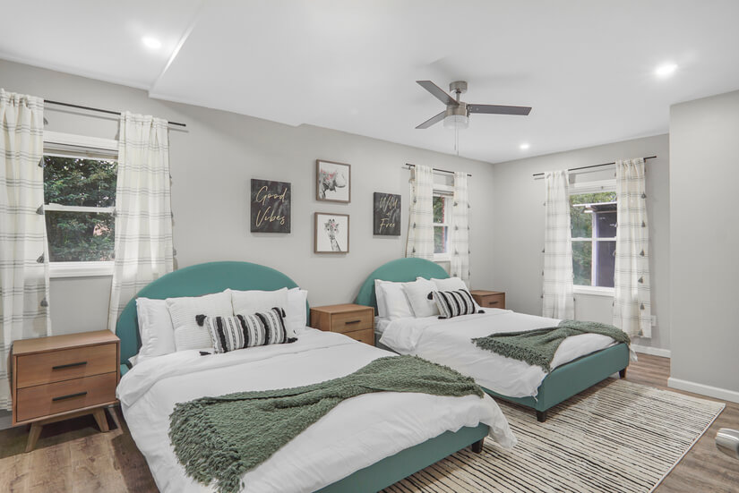 Bedroom graced with two queen beds