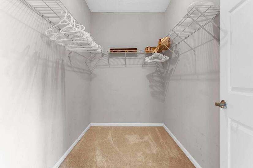 Big closet with hangers for your wardrobe.