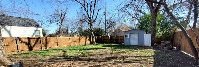 backyard. full fencing. new grass in Spring.