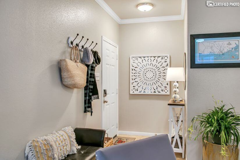 Smart touches throughout , including coat hooks at entry.