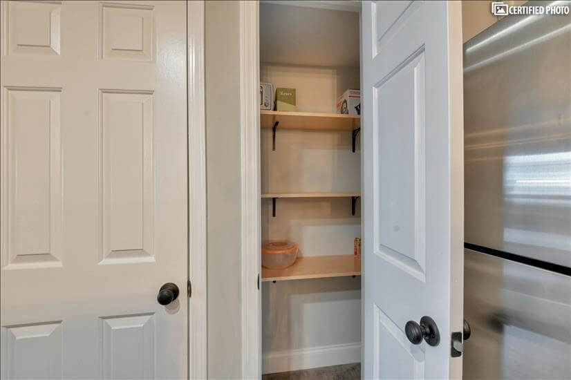 Walk in pantry with lots of shelves