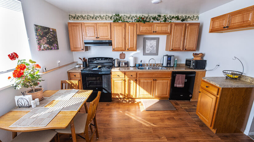 Fully equipped kitchen with new dishwasher, stove, cabinets.