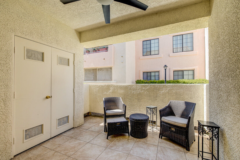 Covered Patio with ceiling fan and seating