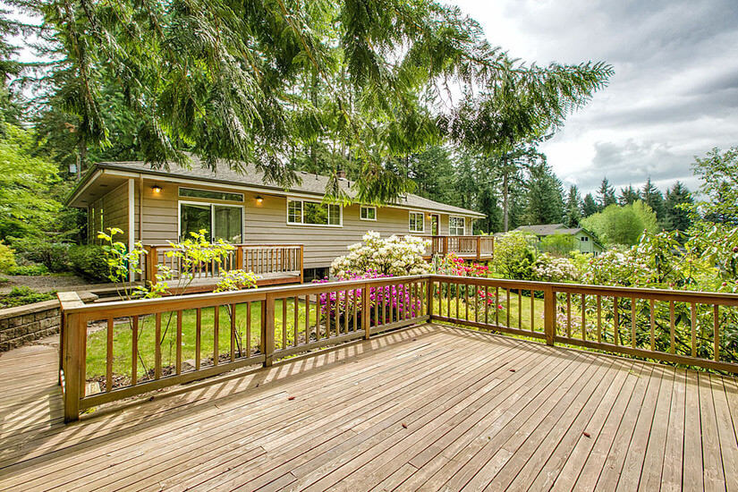view of house from backyard 3rd deck
