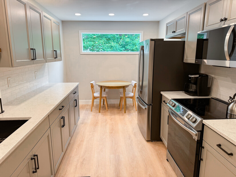 Kitchen has lots of natural light and a dining area.