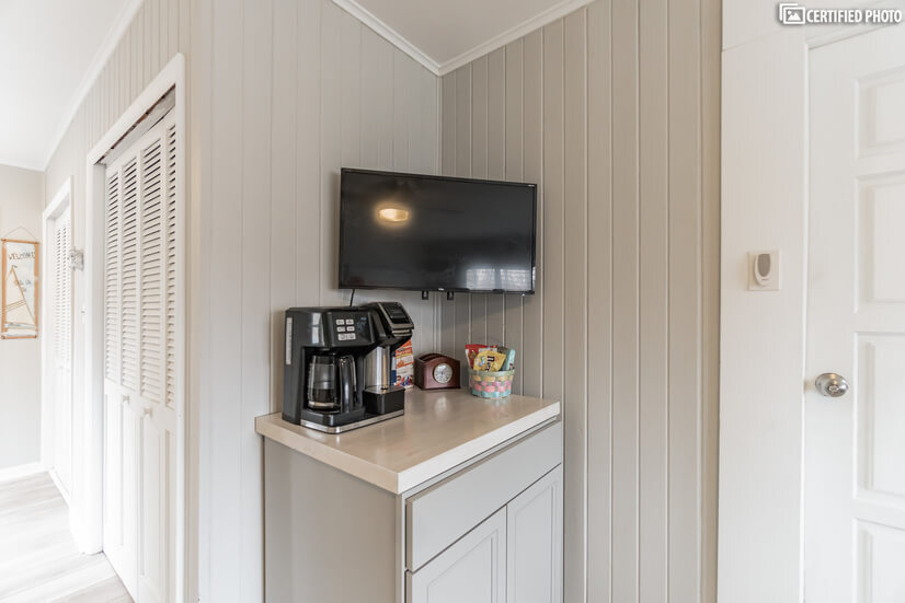 Coffee bar/storage cabinet and 33" mounted TV