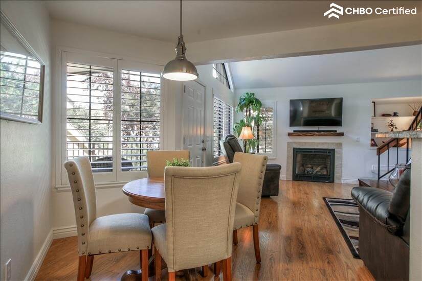 Dining table with view of TV and Gas Fireplac