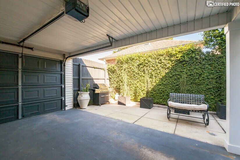 Covered carport with attached storage.