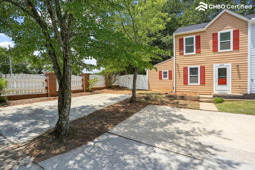 Front view with 4 designated parking spots