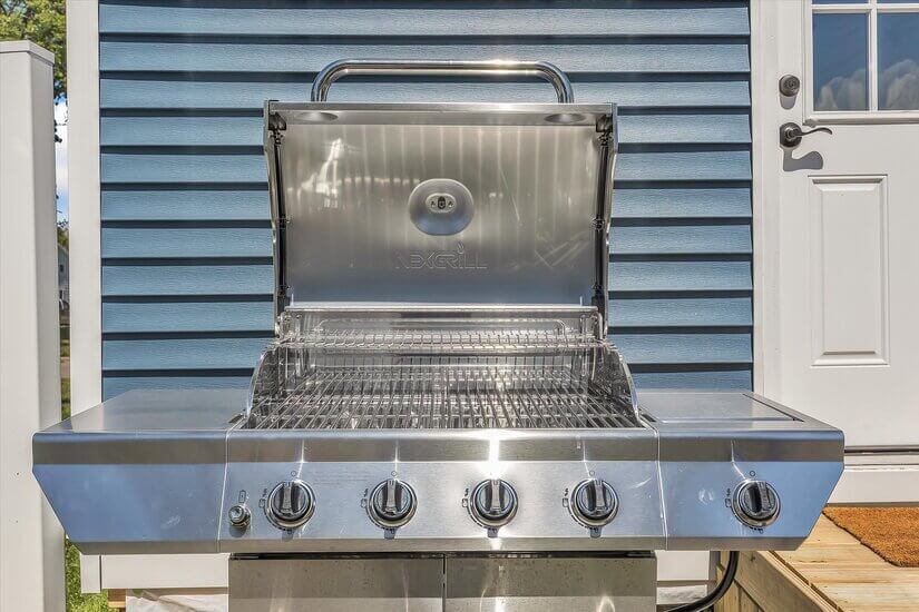 Large, natural-gas grill for outdoor cooking.