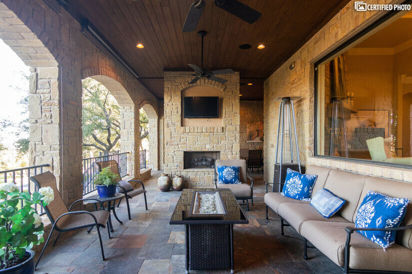 Outdoor living space with TV and fireplace