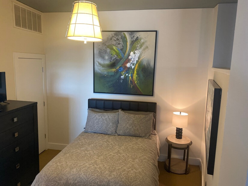 Bedroom 2 with full size bed and tallboy