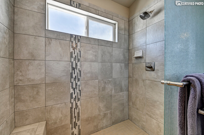 Large Tile Shower with Views of Pikes Peak in Master bath