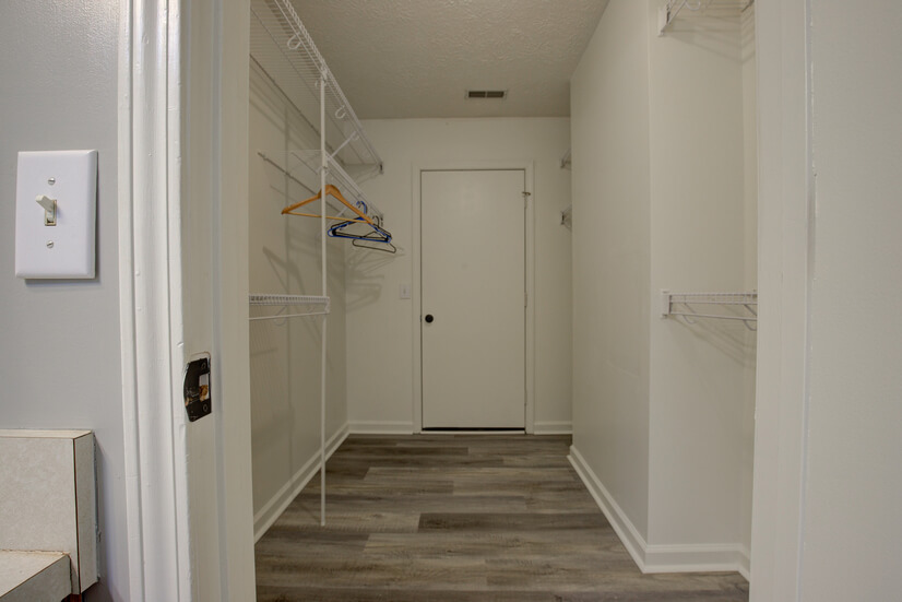 Settle in and unload in the primary walk-in closet