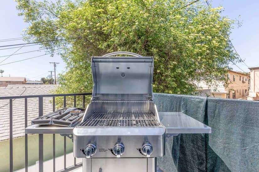 New propane BBQ grill in spacious balcony