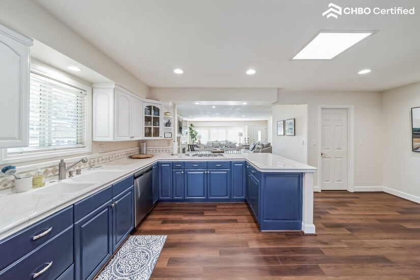 Bright kitchen is well equipped for cooking and entertaining